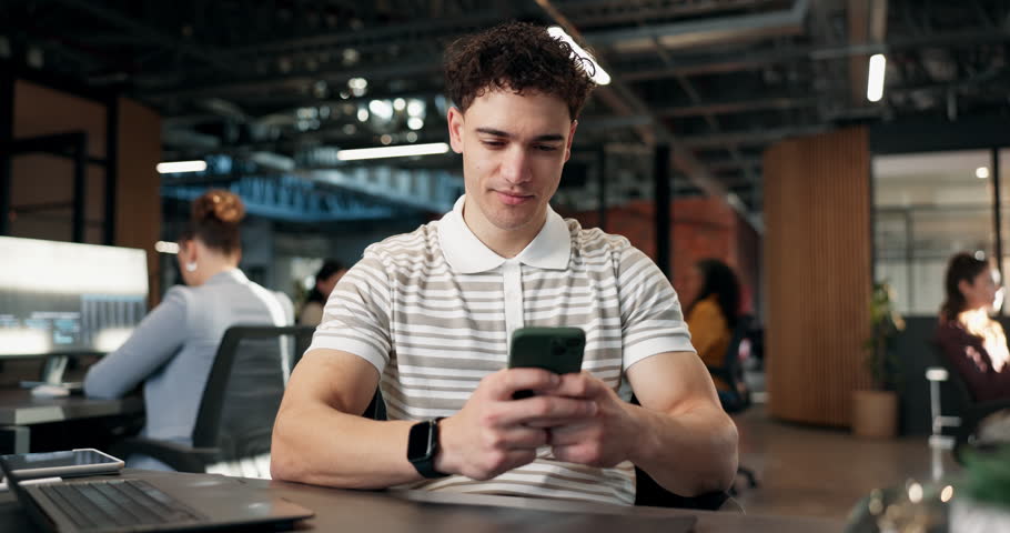 Happy, business and man in office with phone, news research and email source to confirm facts. Male person, coworking and review in workplace with mobile, proofreading and story draft for publication