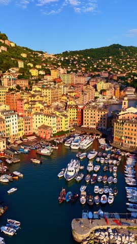 vertical drone shot of sunset in the luxury Italian resort town of Camogli on Italian Riviera near Genoa, vacation in Italy, drone shot of Italian Mediterranean village in Liguria