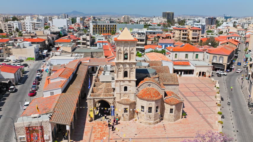 Aerial view of Church of Saint Lazarus in Larnaca, Cyprus. Historic stone architecture, red rooftops and surrounding old town streets create a scenic heritage view.