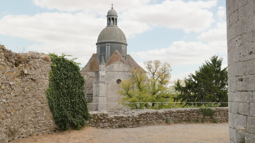 Saint Quiriace Collegiate Church Framed by Medieval Stone Ramparts in Provins