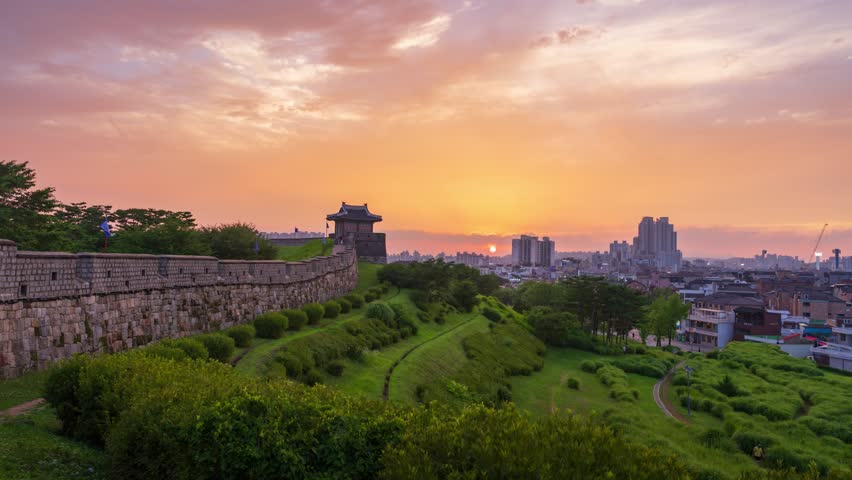 The golden hour casts a magical glow over Hwaseong Fortress. A beautiful blend of ancient history and nature in Suwon