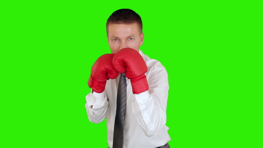 Young businessman boxing and hitting himself, close-up, Green Screen