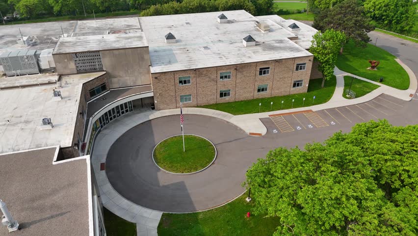 A landscape that embellishes a school building.