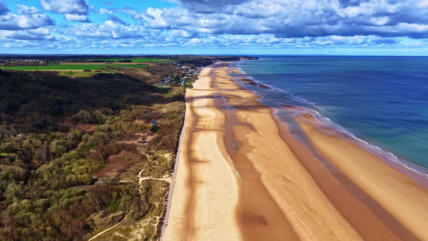 Aerial view of the sandy beach and coastal cliffs along the Atlantic ocean in France.