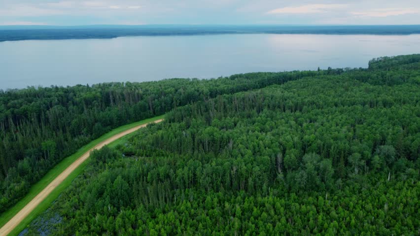 Aerial View of a Gravel Road Along the Shore of South Wabasca Lake, Alberta, Canada