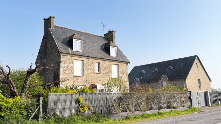 Traditional stone house architecture in village of Pontorson, France