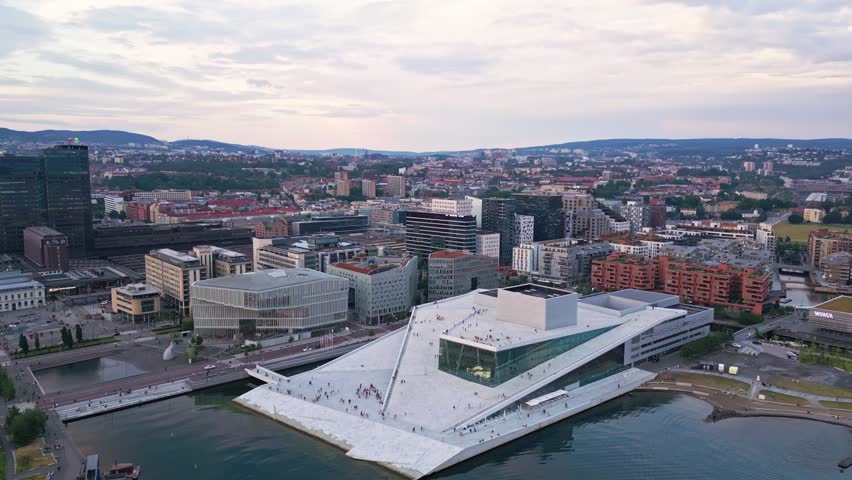 Aerial view of the iconic Oslo Opera House with its sloping white marble roof and glass facade overlooking the waterfront in the city center of Oslo, Oslo, Norway.