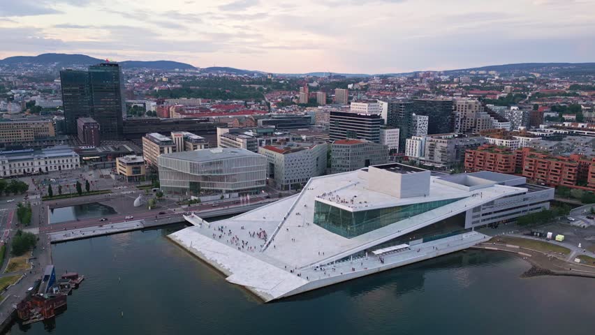 Aerial view of the iconic Oslo Opera House with its white marble roof and glass facade situated on the waterfront in Oslo, Oslo, Norway.