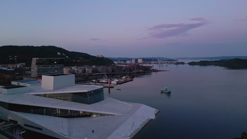 Aerial view of the modern Oslo Opera House on the waterfront of the Oslofjord at dusk in Oslo, Oslo, Norway.