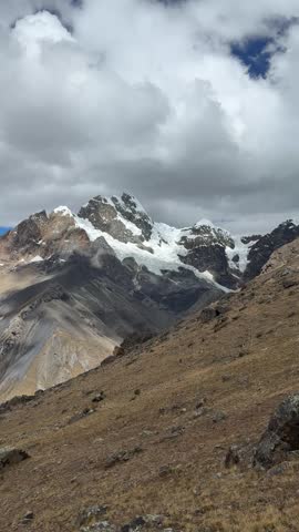 Snow-Capped mountain peaks and valley in Huayhuash, Peru.