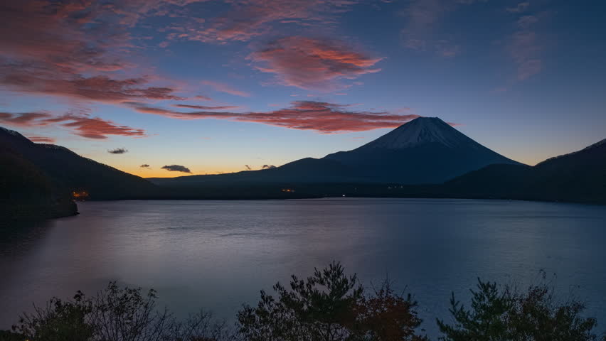 Timelapse night to sunrise over mountain Fuji, Motosu lake, Japan 