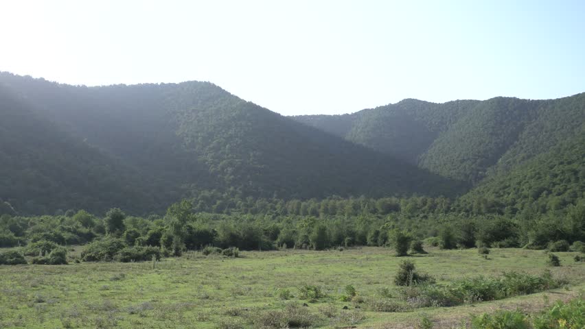 Scenic view of a majestic valley landscape featuring rolling hills, lush greenery, and breathtaking natural scenery that captures the tranquility and grandeur of the great outdoors.