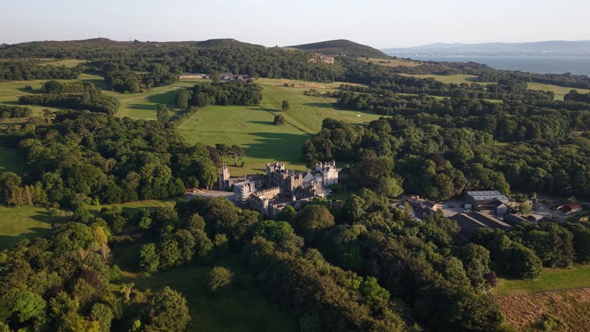 Howth Castle, Ireland. Aerial birds eye view of historical landmark on peninsula close to Dublin.