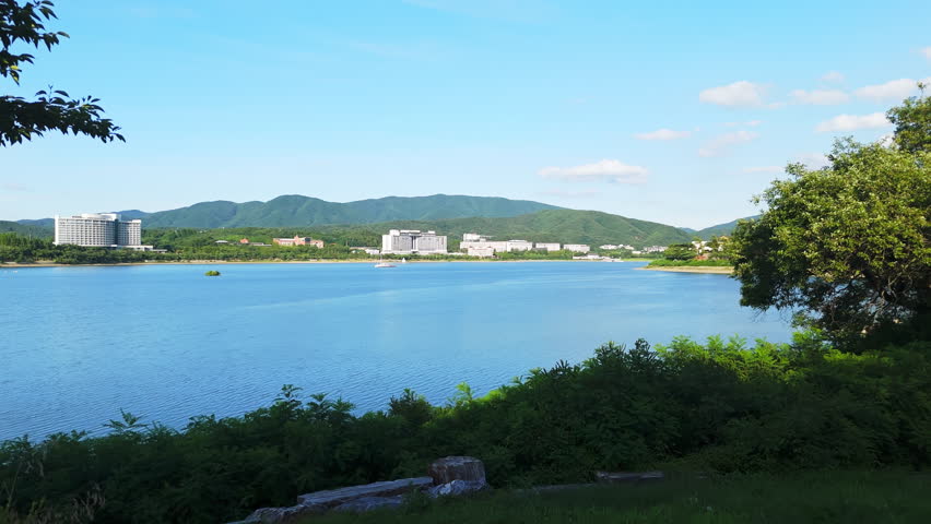 Aerial view rising over Bomun lake in Gyeongju, sunny, summer day in South Korea
