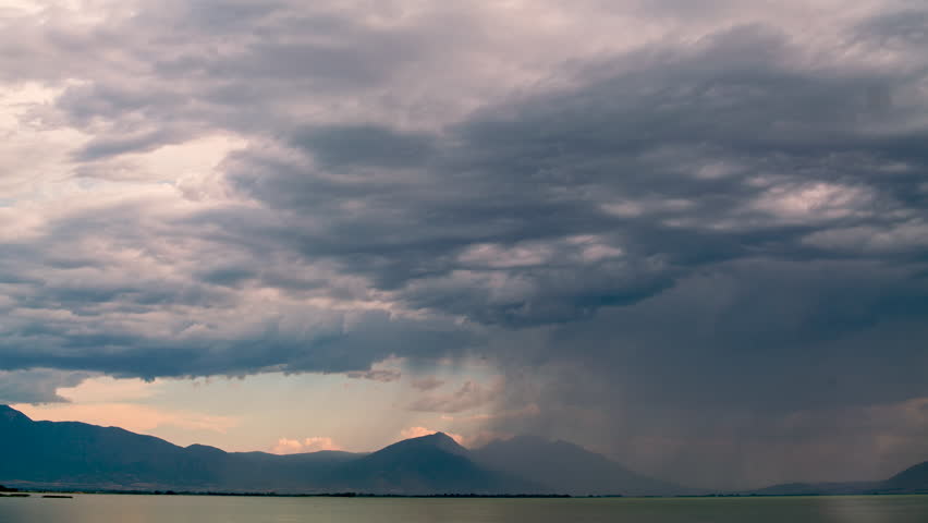 Timelapse of clouds moving over Utah Lake during summer monsoon as it rains.