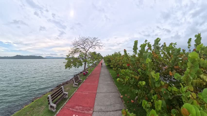 Scenic coastal walkway and bike path with ocean views in Panama