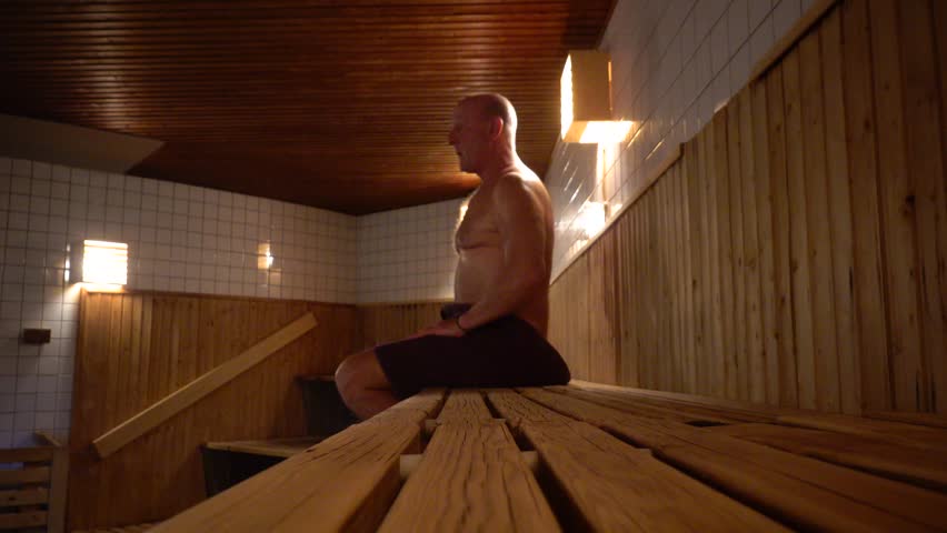 Stockholm, Sweden A man does callisthenics in a sauna.