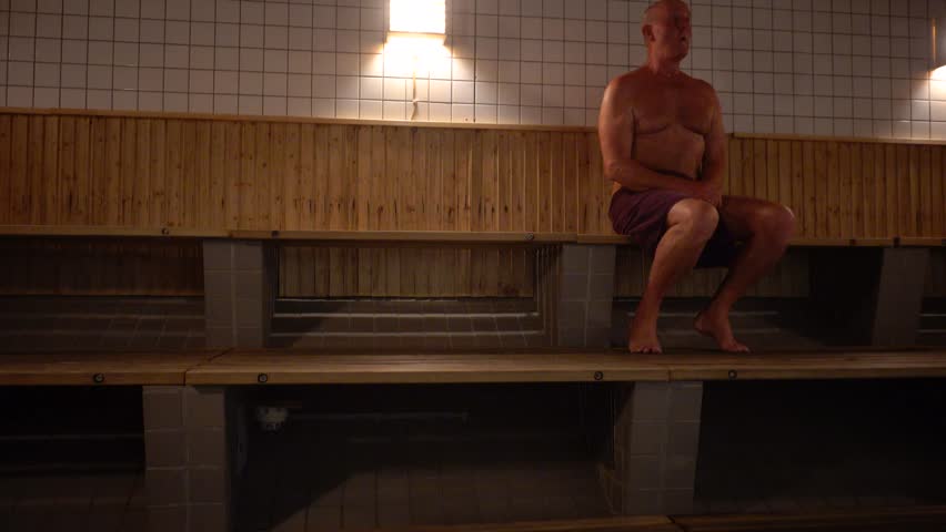 Stockholm, Sweden A man does callisthenics in a sauna.