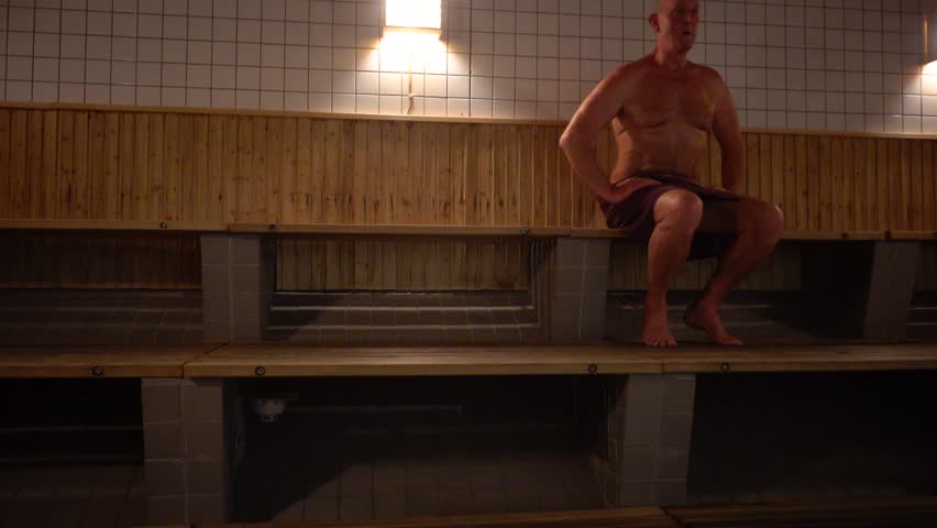 Stockholm, Sweden A man does callisthenics in a sauna.