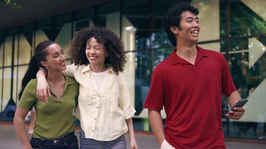 Video of group of friends having fun and talking while crossing the street.