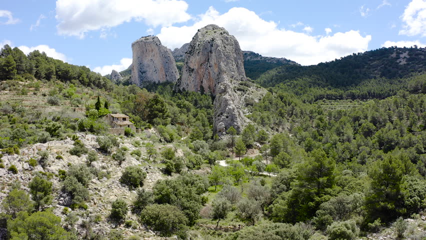 Bird view of granite mountais and Mediterranean pine forests, in the area of La Marina Alta, Alicante, Spain. 