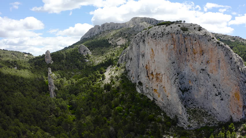 Bird view of granite mountais and Mediterranean pine forests, in the area of La Marina Alta, Alicante, Spain. 