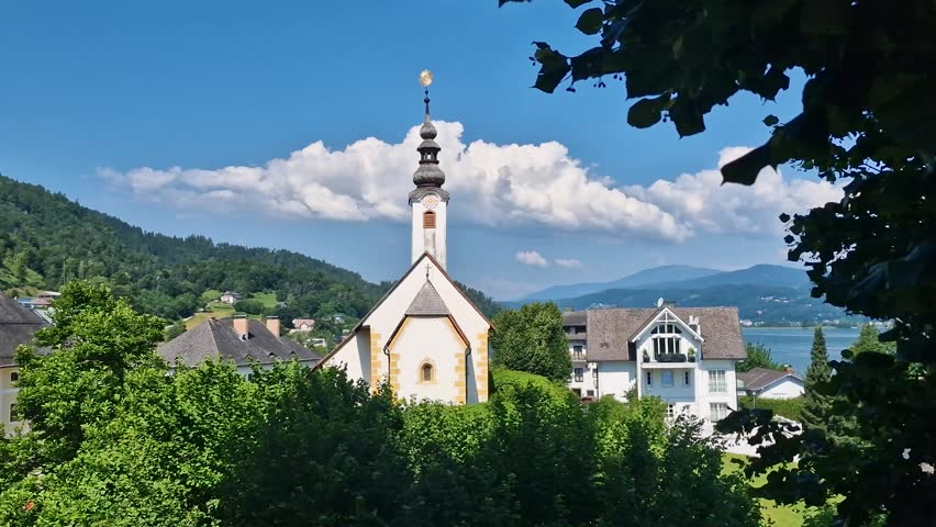 Church of Rosary in Maria Worth Village, Austria. Catholic Landmark by Worthersee Lake on Sunny Summer Day