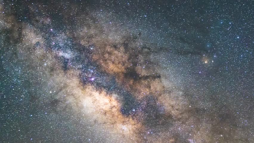 Astro timelapse capturing the luminous core of the Milky Way galaxy. Rich star fields, colorful interstellar dust and nebula fill the dark night sky. Pure celestial scene without landscape.timelapse