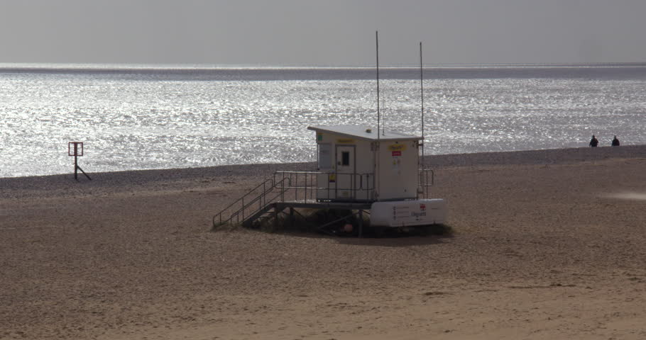 wide shot looking at South beach with Lifeguard station Hut