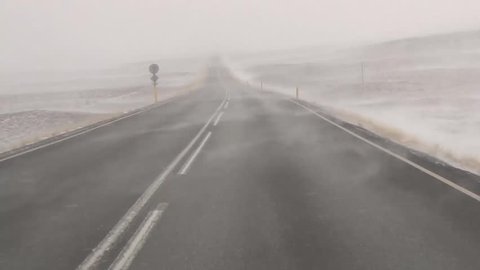 A car driving through a snowstorm in Iceland pov