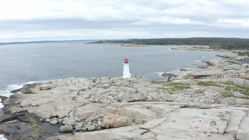 Aerial View of Peggy’s Cove Lighthouse on Rocky Coastline in Nova Scotia