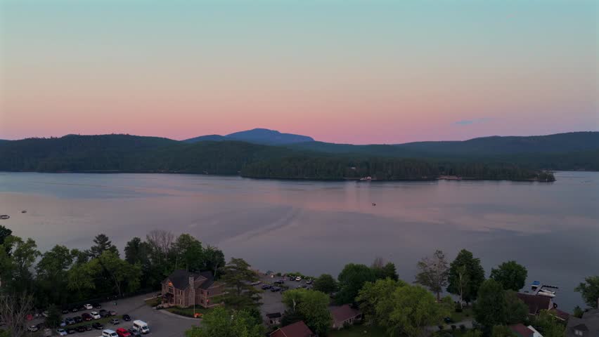 WOL The Island harbor view ferry Ponton boats dock lodging cars Lake Schroon aerial drone view Town of Schroon Lake Up State New York summer sunset lakeside harbor view shoreline beach circle left
