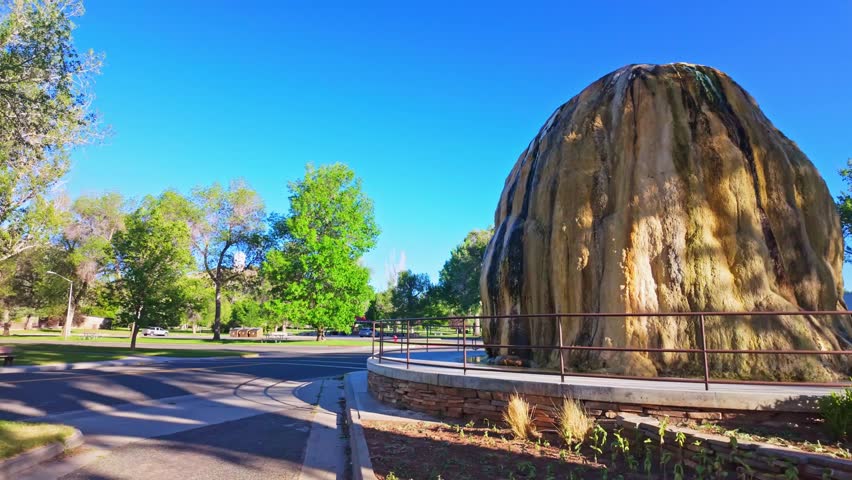 View of the TePee Fountain mineral spring at Hot Springs State Park in Thermopolis Wyoming with towering travertine deposits
