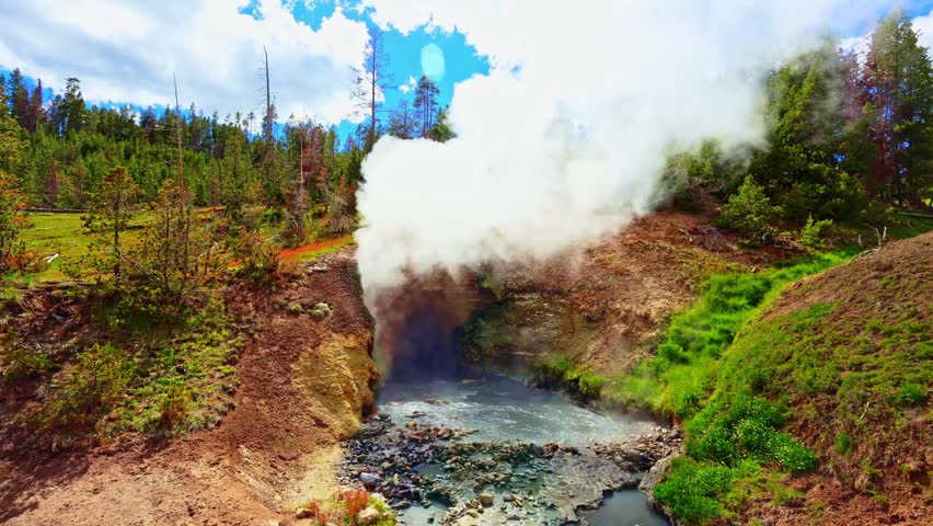 Steaming geothermal features line the shore of Yellowstone Lake in Yellowstone National Park