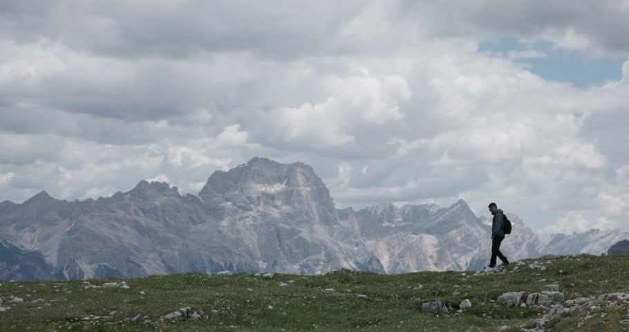 A man walks through the Cinque Torri area in Cortina d