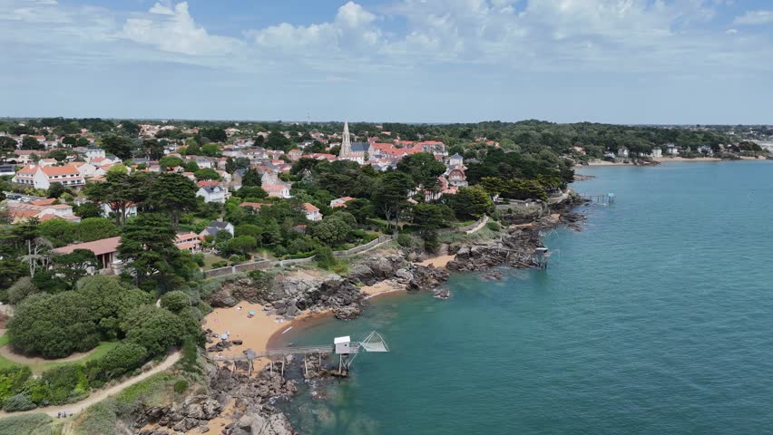 Row of Traditional Carrelet Fishing Huts on Stilts, Pornic, France drone aerial view