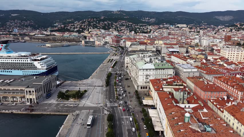 Flight over seaside waterfront promenade in Trieste, Italy