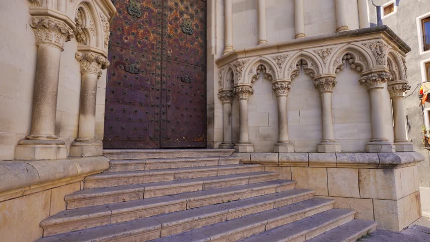 Detailed view of the carved doorway and columns at Cuenca Cathedral in Spain