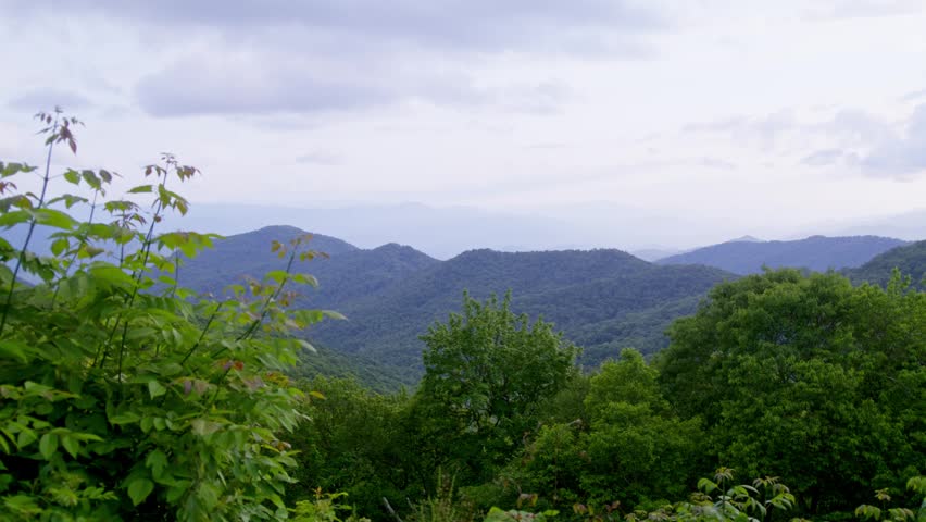 Mountains and clouds in the Great Smoky Mountains National Park with video panning left to right slowly.