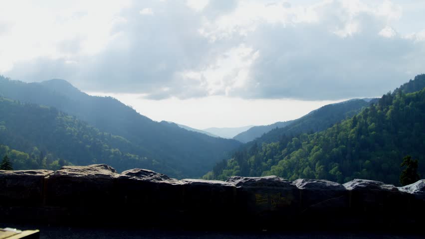 Mountains and clouds with brick overlook at the Great Smoky Mountains National Park with video panning left to right.