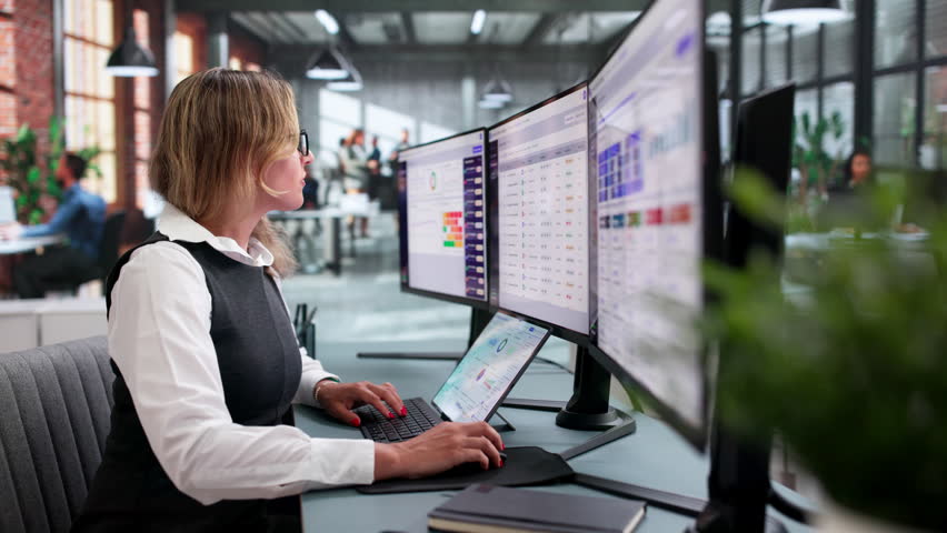 Compliance Manager Reviews Risk Matrix On Laptop For Internal Audit Effectiveness.