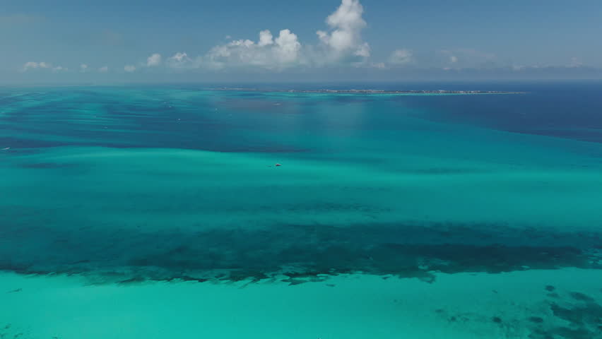 Aerial view of Cancun coastline with hotels and clear turquoise sea, Mexico