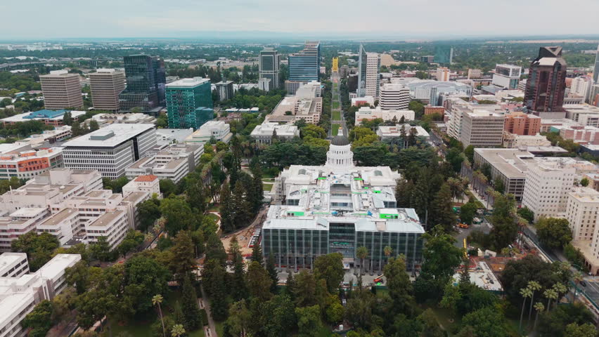 View Of The California State Capitol Annex Project Under Construction With Surrounding City Landmarks In Sacramento, California, USA.Aerial Pullback Shot