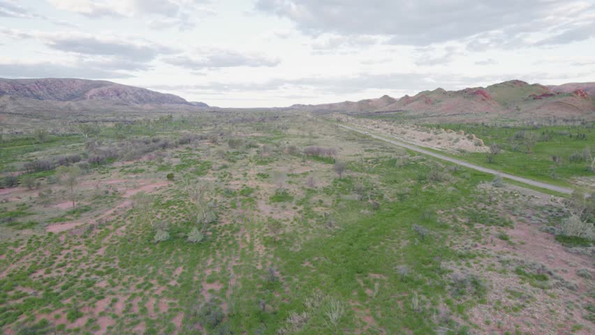Australian Outback Landscape With 4X4 Truck on Distant Road in West MacDonnell Ranges Australia Aerial Drone Shot