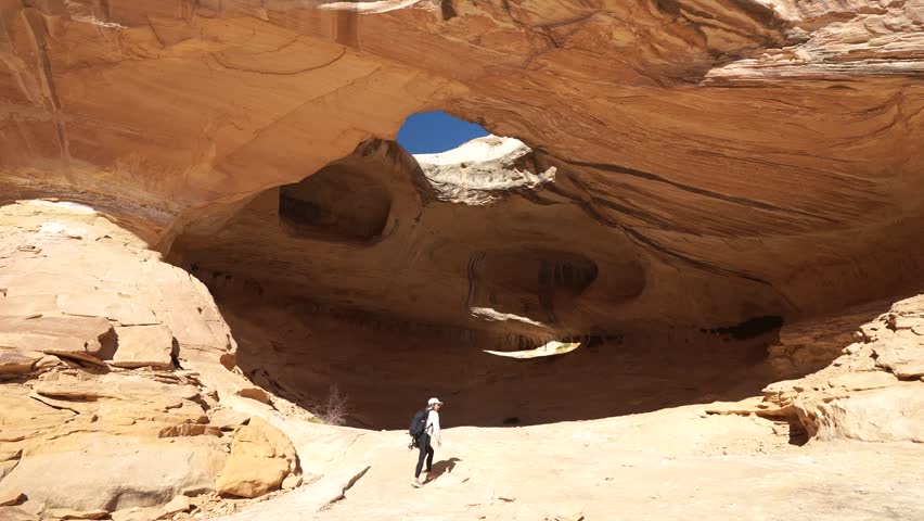 Female Hiker and Dog on Wild Horse Window Trail, San Rafael Swell, Natural Landmark of Utah USA