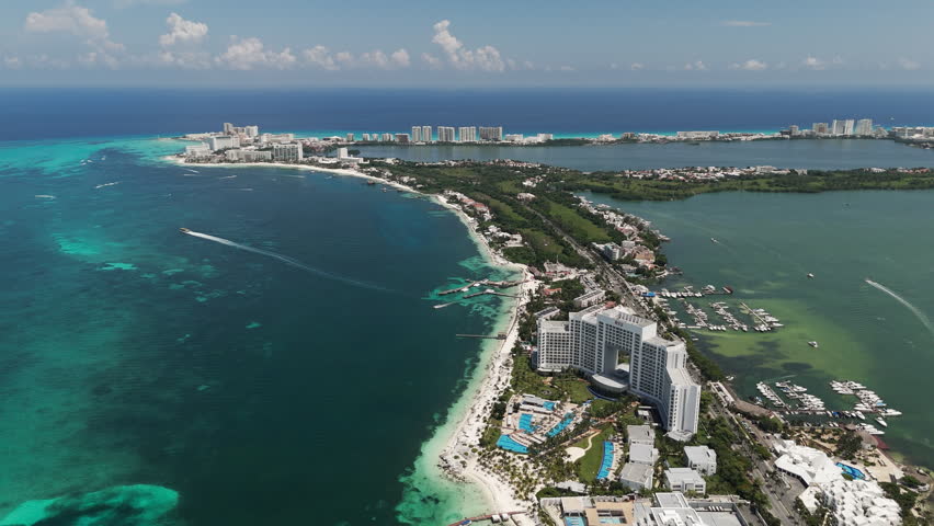 Aerial drone shot of Cancun beach hotels along turquoise coastline, Mexico