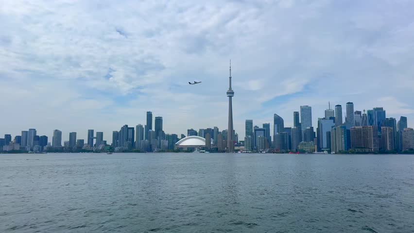 Beautiful view of the city of Toronto, Canada. Toronto skyline with skyscrapers and CN Tower, reflecting in the calm water, showcasing a vibrant urban landscape in Canada.