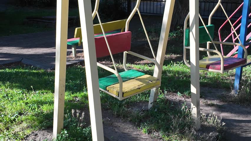 Colorful swings in a park during the afternoon