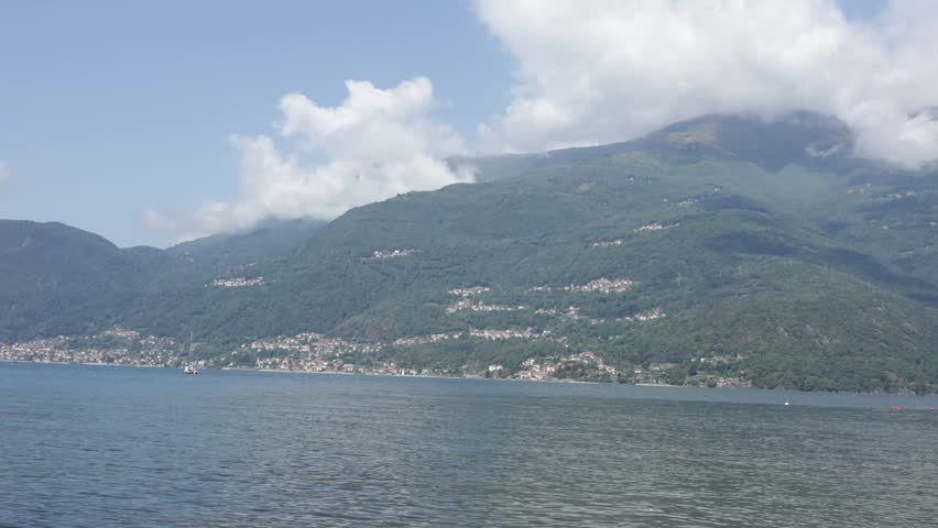 Scenic Lake Como Landscape with Flying Bird, Mountains and Calm Water