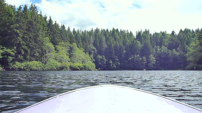 Oregon lake scenic on beautiful summer day, point of view while riding paddle